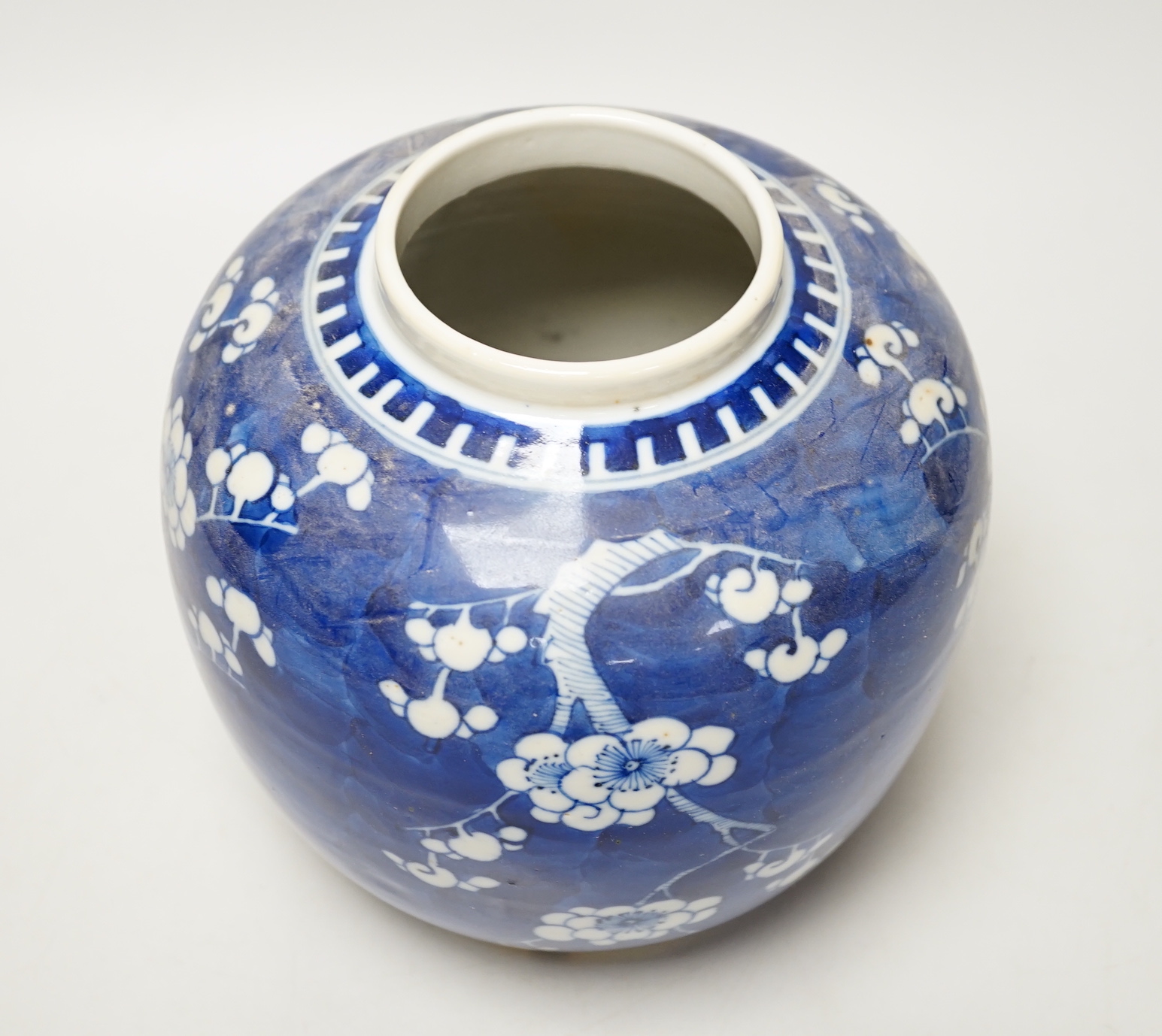 A 19th/20th century Chinese blue and white prunus jar and cover, 22cm